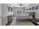 Cozy bedroom featuring a ceiling fan, queen bed, and dark wood furniture at 308 Burnt Pine Ct, Apex, NC 27502