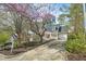 Charming home featuring a welcoming front porch, a one-car garage and well-manicured front yard at 308 Burnt Pine Ct, Apex, NC 27502