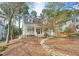 Charming home with a welcoming front porch and landscaped front yard with a winding rock border at 308 Burnt Pine Ct, Apex, NC 27502