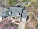 Aerial view of a charming home with a welcoming front porch and a well-maintained yard at 308 Burnt Pine Ct, Apex, NC 27502