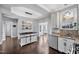 Bright eat-in kitchen with granite counters, stainless steel appliances and wood floors at 308 Burnt Pine Ct, Apex, NC 27502