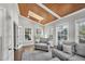 Comfortable living room with vaulted wood ceilings and plenty of natural light at 308 Burnt Pine Ct, Apex, NC 27502