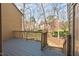 Back deck overlooking a backyard with mature trees at 3207 Coachmans Way, Durham, NC 27705