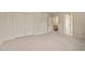 Large bedroom with carpet flooring, closets and doorway leading to the staircase at 3207 Coachmans Way, Durham, NC 27705