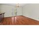 Spacious dining room with hardwood floors and access to an outdoor patio at 3207 Coachmans Way, Durham, NC 27705