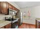 Updated kitchen with stainless steel appliances and granite countertops at 3207 Coachmans Way, Durham, NC 27705