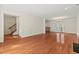 Bright living room with hardwood floors, fireplace and a bar area leading to the dining space at 3207 Coachmans Way, Durham, NC 27705