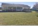 Spacious backyard featuring a covered patio, deck and a well-maintained lawn at 3226 Powhatan Rd, Clayton, NC 27527