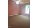 Bright bedroom features a ceiling fan, a window and carpeted floor at 3226 Powhatan Rd, Clayton, NC 27527