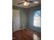 Bedroom with hardwood floors, a ceiling fan and natural light at 3226 Powhatan Rd, Clayton, NC 27527