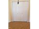Bedroom closet with laminate flooring and ample space for storage at 3226 Powhatan Rd, Clayton, NC 27527