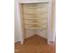 Spacious closet with laminate floors and shelving system maximizing storage at 3226 Powhatan Rd, Clayton, NC 27527