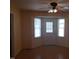 Bright dining area with laminate flooring and large windows offering plenty of natural light at 3226 Powhatan Rd, Clayton, NC 27527