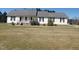 Inviting single-story home with classic facade, covered porch, and manicured front yard at 3226 Powhatan Rd, Clayton, NC 27527
