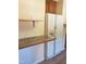 Functional kitchen area with a vintage refrigerator and countertop area for appliances at 3226 Powhatan Rd, Clayton, NC 27527