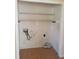 Empty laundry room with hookups and wire shelving at 3226 Powhatan Rd, Clayton, NC 27527