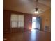 Inviting living room features laminate flooring, large windows and a ceiling fan at 3226 Powhatan Rd, Clayton, NC 27527