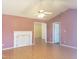 Spacious living room features laminate flooring and a fireplace, ready for customization at 3226 Powhatan Rd, Clayton, NC 27527