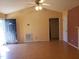 Inviting living room featuring laminate flooring, high ceilings and a ceiling fan at 3226 Powhatan Rd, Clayton, NC 27527