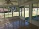 Bright sunroom with tile flooring and multiple windows offering natural light and views at 3226 Powhatan Rd, Clayton, NC 27527