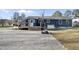 Blue home with deck and gravel drive, great for outdoor activities and parking at 352 Leonard Rd, Louisburg, NC 27549