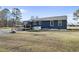 The back of the house showing a basketball hoop, back deck, and exterior windows at 352 Leonard Rd, Louisburg, NC 27549