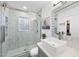 Modern bathroom with glass shower, sleek sink, and contemporary finishes at 352 Leonard Rd, Louisburg, NC 27549
