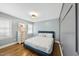 Bright bedroom with hardwood floors and a comfortable-looking bed and dresser at 352 Leonard Rd, Louisburg, NC 27549
