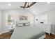 Cozy bedroom with vaulted ceiling, a comfortable queen-sized bed and great natural light at 352 Leonard Rd, Louisburg, NC 27549