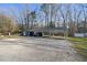 Two carports and an outbuilding in the backyard, offering extra storage and parking at 352 Leonard Rd, Louisburg, NC 27549