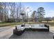 Relaxing outdoor deck area with comfortable wicker furniture is the perfect place for relaxation at 352 Leonard Rd, Louisburg, NC 27549