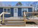 Cozy deck features a seating area, ideal for relaxing outdoors at 352 Leonard Rd, Louisburg, NC 27549