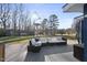 Outdoor deck area with nice furniture, perfect for relaxing and enjoying the surrounding scenery at 352 Leonard Rd, Louisburg, NC 27549