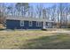 Charming blue home featuring a deck and well-maintained lawn, perfect for outdoor living at 352 Leonard Rd, Louisburg, NC 27549