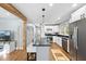 Bright eat in kitchen with hardwood floors, stainless appliances, and center island with breakfast bar at 352 Leonard Rd, Louisburg, NC 27549