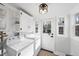Clean, bright laundry room with washer, dryer, and ample storage space and natural light at 352 Leonard Rd, Louisburg, NC 27549