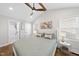 Serene main bedroom with ensuite bath, a ceiling fan, and two windows providing natural light at 352 Leonard Rd, Louisburg, NC 27549