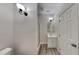This bathroom features a vanity, with wood-look floors and is located next to the shower at 3704 Sky Meadow Dr, Apex, NC 27539