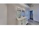 Bright bathroom features a double vanity with modern fixtures, quartz countertops and wood-look floors at 3704 Sky Meadow Dr, Apex, NC 27539