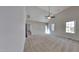 Spacious bedroom with plush carpet, vaulted ceiling, a ceiling fan, and natural light creating a comfortable retreat at 3704 Sky Meadow Dr, Apex, NC 27539
