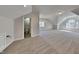 Large bonus room with neutral colored carpet and paint, next to a half bathroom, with good natural light at 3704 Sky Meadow Dr, Apex, NC 27539
