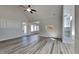 Spacious living room with gray flooring, vaulted ceiling, and access to other areas, perfect for entertaining guests at 3704 Sky Meadow Dr, Apex, NC 27539