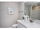 Cozy bathroom featuring neutral tones, a single sink vanity with modern decor, and a tub with shower at 373 Fosterton Cottage Way, Raleigh, NC 27603