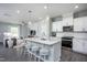 Open concept living room and kitchen area with lots of natural light and modern white cabinets at 373 Fosterton Cottage Way, Raleigh, NC 27603