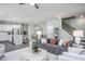 Spacious open-concept living room with sightlines to the kitchen, dining area, and staircase at 373 Fosterton Cottage Way, Raleigh, NC 27603
