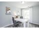 Bright home office with a large white desk, comfortable chairs, natural light, and stylish decor at 373 Fosterton Cottage Way, Raleigh, NC 27603