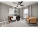 Well-lit office space featuring a modern desk, comfortable chair, and a neutral color palette at 4006 Kidd Pl, Durham, NC 27703