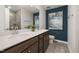 Bathroom with double sinks, tile flooring, granite countertops, and tile shower at 4008 Kidd Pl, Durham, NC 27703