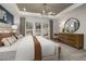 Spacious primary suite with a tray ceiling, three large windows, and ample natural light at 4008 Kidd Pl, Durham, NC 27703