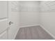 Walk-in closet featuring carpeted flooring and multiple wire rack shelves at 4008 Kidd Pl, Durham, NC 27703
